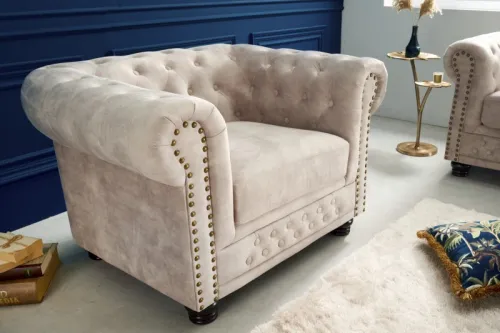Estila Luxusné chesterfield kreslo Contessa s čalúnením vo farbe šampanského s prešívaním a kovovým zdobením 105cm