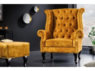 Estila Chesterfield kreslo Cella so zamatovým čalúnením v horčicovo žltej farbe s tmavohnedými masívnymi nožičkami 105cm