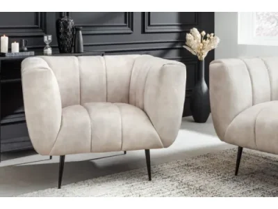 Estila Art deco moderné kreslo Vermont v krémovom champagne čalúnení na čiernych nožičkách 106cm